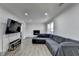 Spacious living room with hardwood floors, fireplace, and large sectional couch at 4087 Signal Rdg, Lilburn, GA 30047