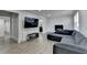 Comfortable living room features recessed lights, hardwood floors, and a fireplace at 4087 Signal Rdg, Lilburn, GA 30047