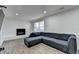 Bright living room showcases a white brick fireplace and modern recessed lighting at 4087 Signal Rdg, Lilburn, GA 30047
