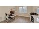 Office with hardwood floors, a large window and built in white shelves and desk at 4087 Signal Rdg, Lilburn, GA 30047
