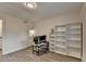 Office with hardwood floors, a large window and built in white shelves at 4087 Signal Rdg, Lilburn, GA 30047