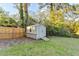 Backyard storage shed with an access ramp nestled in the green backyard of this charming home at 4087 Signal Rdg, Lilburn, GA 30047