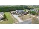 Beautiful home showcasing a three-car garage, well-manicured lawn, and mature landscaping on a spacious lot at 1698 Little Fox Ln, Dacula, GA 30019