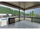 View of a back deck overlooking a pool and gazebo in a private, fenced backyard at 1698 Little Fox Ln, Dacula, GA 30019