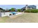 Beautiful backyard featuring a sparkling pool, lounge chairs, and a well-maintained lawn, ideal for relaxation and recreation at 1698 Little Fox Ln, Dacula, GA 30019