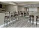 Finished basement with a bar area that features granite counters and seating for entertaining at 1698 Little Fox Ln, Dacula, GA 30019