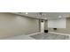 Basement media space featuring a projector, screen, and neutral wall paint at 1698 Little Fox Ln, Dacula, GA 30019