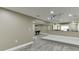 Basement featuring game room with pool table, bar area, and media area for entertaining at 1698 Little Fox Ln, Dacula, GA 30019