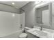 Bathroom featuring a tub, toilet, and vanity with marble countertops at 1698 Little Fox Ln, Dacula, GA 30019