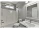 Bathroom with a tub, shower, toilet, vanity, and marble sink at 1698 Little Fox Ln, Dacula, GA 30019