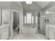 Bright bathroom with garden tub and a glass enclosed shower at 1698 Little Fox Ln, Dacula, GA 30019