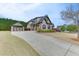 Charming suburban home with three-car garage, spacious driveway, and meticulously maintained landscaping at 1698 Little Fox Ln, Dacula, GA 30019