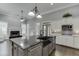 Open floor plan kitchen featuring a large island with seating and stainless steel appliances at 1698 Little Fox Ln, Dacula, GA 30019