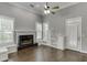 Living room with fireplace, built-in shelving and seating, plus access to the backyard at 1698 Little Fox Ln, Dacula, GA 30019
