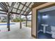 Charming pool house featuring a bathroom, lights and open air seating area with convenient backyard access and views at 1698 Little Fox Ln, Dacula, GA 30019