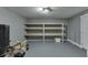 Basement storage room features built-in wooden shelves and a convenient layout at 1698 Little Fox Ln, Dacula, GA 30019