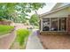 Large backyard showing patio, screened porch and landscaping, perfect for outdoor activities and relaxation at 5581 Stapleton Dr, Dunwoody, GA 30338