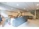 Spacious finished basement with sectional couch and ample lighting at 5581 Stapleton Dr, Dunwoody, GA 30338