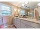 Bathroom with double vanity, white cabinets, and tiled floors at 5581 Stapleton Dr, Dunwoody, GA 30338