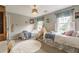 Bedroom with two beds, carpeted floor, and window at 5581 Stapleton Dr, Dunwoody, GA 30338