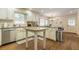 Bright eat-in kitchen with a center island, stainless appliances, and plenty of cabinet space at 5581 Stapleton Dr, Dunwoody, GA 30338