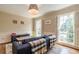 Inviting living room features a comfortable sofa, patterned rug, and soft, natural lighting, creating a warm ambiance at 5581 Stapleton Dr, Dunwoody, GA 30338