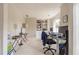 Bright office space with built-in bookshelves and neutral carpeting at 5581 Stapleton Dr, Dunwoody, GA 30338