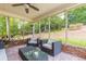 Relaxing screened porch with backyard views, comfortable seating, and a ceiling fan for warm days at 5581 Stapleton Dr, Dunwoody, GA 30338