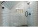 Tiled shower with glass door and built in shelves at 5581 Stapleton Dr, Dunwoody, GA 30338