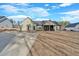 Open backyard view showcasing a house with a patio and a detached garage, perfect for entertaining at 598 Barnwood Dr, Rockmart, GA 30153