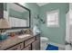 Well-lit bathroom with granite countertop, undermount sink, and nautical decor at 598 Barnwood Dr, Rockmart, GA 30153