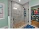 Bathroom featuring a walk-in shower with tile and glass surround at 598 Barnwood Dr, Rockmart, GA 30153