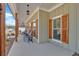 Inviting covered porch with comfortable seating, wood pillars, and wooden shutters create a welcoming exterior space at 598 Barnwood Dr, Rockmart, GA 30153