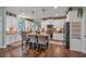 Modern kitchen featuring white cabinets, stainless steel appliances, and center island with seating at 598 Barnwood Dr, Rockmart, GA 30153