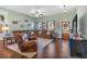 Cozy living room with hardwood floors, a comfortable sectional, recliner, and natural light, creating an inviting atmosphere at 598 Barnwood Dr, Rockmart, GA 30153