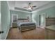 Bedroom with tray ceiling, ceiling fan and carpet flooring at 598 Barnwood Dr, Rockmart, GA 30153