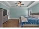 Spacious primary bedroom features a ceiling fan and carpeting at 598 Barnwood Dr, Rockmart, GA 30153