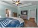Main bedroom features a ceiling fan and includes an ensuite bathroom at 598 Barnwood Dr, Rockmart, GA 30153