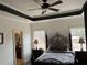 Stylish main bedroom featuring ample natural light at 10390 Rivertown Rd, Fairburn, GA 30213