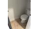 Small toilet room featuring tile floor, toilet and access door at 10390 Rivertown Rd, Chattahoochee Hills, GA 30213