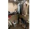 This walk-in closet is filled with clothes and other items at 10390 Rivertown Rd, Chattahoochee Hills, GA 30213