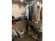 Walk-in closet featuring wire shelving, hanging rods and assorted clothing and storage items at 10390 Rivertown Rd, Fairburn, GA 30213