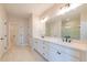 Modern bathroom featuring dual sinks, a large mirror, and a glass-enclosed shower with beautiful tile work at 108 Redford Ln, Canton, GA 30115
