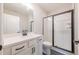 Modern bathroom featuring a sleek vanity, black fixtures, and a glass-enclosed shower at 108 Redford Ln, Canton, GA 30115