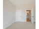 Bedroom featuring a neutral color scheme, carpet, and doorways to the rest of the home at 108 Redford Ln, Canton, GA 30115