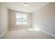Bedroom featuring a window that offers natural light and views of the neighborhood at 108 Redford Ln, Canton, GA 30115