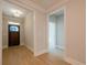 Light and airy entryway features a wooden front door, neutral walls, and attractive wood-look flooring at 108 Redford Ln, Canton, GA 30115