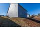 Side view of a home with gray siding and a well-maintained lawn at 108 Redford Ln, Canton, GA 30115