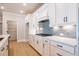 Modern kitchen showcases white cabinets, subway tile backsplash, and stainless steel appliances at 108 Redford Ln, Canton, GA 30115