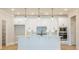 Modern kitchen with a large island, stainless steel appliances, and plenty of storage space at 108 Redford Ln, Canton, GA 30115